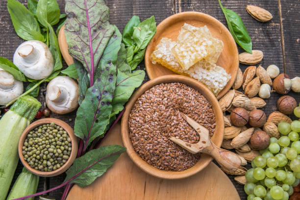 Magnesium-rich UK foods including seeds, leafy greens and whole grains